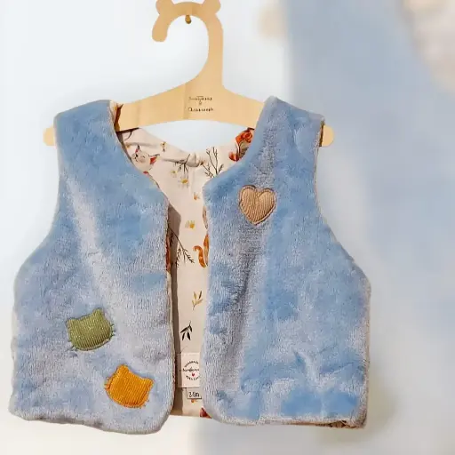 Gilet de berger fausse fourrure bleu ciel 3/6 mois
